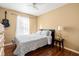 Cozy bedroom featuring a ceiling fan, accent guitar, and warm, inviting wall color at 53 Juniper Trail Cir, Ocala, FL 34480