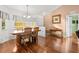 Bright dining room with big windows and chandelier at 53 Juniper Trail Cir, Ocala, FL 34480