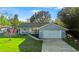 Charming single Gathering home with attached garage, landscaped lawn and covered front porch at 53 Juniper Trail Cir, Ocala, FL 34480