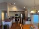 Updated kitchen features stainless steel appliances, modern countertops, and ample cabinet space at 53 Juniper Trail Cir, Ocala, FL 34480