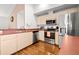 Modern kitchen featuring stainless steel appliances and lots of natural light at 53 Juniper Trail Cir, Ocala, FL 34480