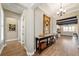 Elegant foyer with wood-look tile flooring and a decorative console table at 5331 Nw 35Th Lane Rd, Ocala, FL 34482