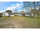Expansive backyard with a screened lanai, detached garage, and plenty of green space at 5926 Ne 62Nd Court Rd, Silver Springs, FL 34488