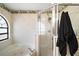 Bathroom showcasing a soaking tub with a shower, wallpapered walls, and tile flooring at 5926 Ne 62Nd Court Rd, Silver Springs, FL 34488