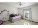 Cozy bedroom with a daybed, soft colors, natural light, and unicorn decor at 5926 Ne 62Nd Court Rd, Silver Springs, FL 34488