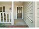 Inviting front door with decorative glass, sidelights, and craftsman-style trim at 5926 Ne 62Nd Court Rd, Silver Springs, FL 34488
