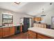Kitchen with brick flooring, stainless steel appliances, and a built-in buffet at 5926 Ne 62Nd Court Rd, Silver Springs, FL 34488