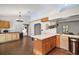Bright kitchen with brick flooring, a central island, and plenty of storage and counter space at 5926 Ne 62Nd Court Rd, Silver Springs, FL 34488