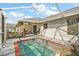 Covered patio with an in-ground pool, offering a relaxing outdoor living space at 5926 Ne 62Nd Court Rd, Silver Springs, FL 34488