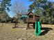 Outdoor play structure with slide at 5926 Ne 62Nd Court Rd, Silver Springs, FL 34488