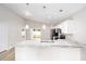 Kitchen with stainless steel appliances, white cabinets, and marble countertops at 6620 Se 108Th Ln, Belleview, FL 34420