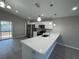 Modern kitchen featuring stainless steel appliances and a stylish breakfast bar at 6620 Se 108Th Ln, Belleview, FL 34420