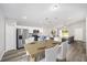 Bright kitchen features stainless steel appliances, marble countertops, and an adjacent dining area at 6620 Se 108Th Ln, Belleview, FL 34420