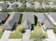 Overhead view of a house with a driveway, showcasing a well-maintained yard and neighborhood at 7234 Sw 91St Ct, Ocala, FL 34481