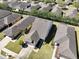 Overhead view of a home, displaying its landscaping, roof, and proximity to neighboring houses at 7234 Sw 91St Ct, Ocala, FL 34481