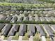 Aerial view of a residential neighborhood with well-maintained homes and tree-lined streets at 7234 Sw 91St Ct, Ocala, FL 34481