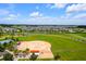 Aerial view of a community baseball field surrounded by homes and green spaces at 7234 Sw 91St Ct, Ocala, FL 34481