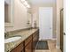 Bathroom featuring double sinks, granite countertops, and lots of storage at 7234 Sw 91St Ct, Ocala, FL 34481