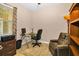 Well-lit office with a desk, ergonomic chair, and ample storage options for productivity at 7234 Sw 91St Ct, Ocala, FL 34481