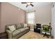 Comfortable bedroom with a sofa, desk, and closet providing ample space for relaxation and work at 7234 Sw 91St Ct, Ocala, FL 34481