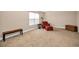 Expansive bedroom with comfortable seating, natural light, and plenty of open space at 7234 Sw 91St Ct, Ocala, FL 34481