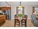 Dining area with a table and chairs next to the kitchen with stainless steel appliances at 7234 Sw 91St Ct, Ocala, FL 34481