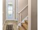 Welcoming entryway with tiled floors, a decorative glass door, and carpeted stairs at 7234 Sw 91St Ct, Ocala, FL 34481