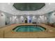 Indoor common area hot tub boasts tile floors and architectural details at 7234 Sw 91St Ct, Ocala, FL 34481