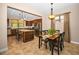 Spacious kitchen and dining area, with a large island, stainless steel appliances, and lots of natural light at 7234 Sw 91St Ct, Ocala, FL 34481