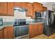 The modern kitchen features stainless steel appliances, granite countertops, and updated cabinets at 7234 Sw 91St Ct, Ocala, FL 34481