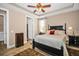 Relax in the main bedroom featuring a ceiling fan, and tile flooring at 7234 Sw 91St Ct, Ocala, FL 34481