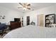 Bedroom features a full closet, dresser and ensuite bathroom at 7935 Sw 89Th Ter, Ocala, FL 34481