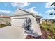 Charming single-Gathering home with a two-car garage, accent lighting, and meticulous landscaping at 7935 Sw 89Th Ter, Ocala, FL 34481