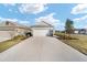 Charming single-Gathering home featuring a two-car garage and well-manicured lawn and landscaping at 7935 Sw 89Th Ter, Ocala, FL 34481