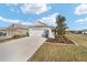 Charming single-Gathering home featuring a two-car garage and well-manicured lawn and landscaping at 7935 Sw 89Th Ter, Ocala, FL 34481