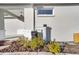Landscaping accents the home's exterior, featuring a water filtration system at 7935 Sw 89Th Ter, Ocala, FL 34481