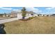 Charming single-Gathering home featuring a two-car garage and well-manicured lawn and landscaping at 7935 Sw 89Th Ter, Ocala, FL 34481