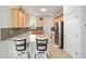 Modern kitchen featuring granite countertops, stainless steel appliances, and a breakfast bar at 7935 Sw 89Th Ter, Ocala, FL 34481