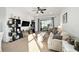 Inviting living room featuring neutral decor, built-in shelving, and sliding glass doors to the outdoors at 7935 Sw 89Th Ter, Ocala, FL 34481
