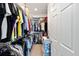 Walk-in closet offers ample storage with organized shelving and hanging space at 7935 Sw 89Th Ter, Ocala, FL 34481