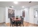 Bright dining room with a round wood table, stylish chairs, and elegant decor for comfortable dining at 8665 Sw 94Th Ln # C, Ocala, FL 34481