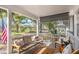 Charming front porch with comfortable seating, stylish decor, and a serene view of the neighborhood at 8665 Sw 94Th Ln # C, Ocala, FL 34481