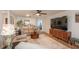 Open living room featuring hardwood floors, modern decor, and a ceiling fan at 8665 Sw 94Th Ln # C, Ocala, FL 34481