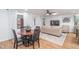 Inviting living room with an open floor plan, comfortable furniture, and a dining area, perfect for entertaining at 8665 Sw 94Th Ln # C, Ocala, FL 34481