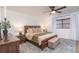 Comfortable main bedroom features a ceiling fan, with natural light from window at 8665 Sw 94Th Ln # C, Ocala, FL 34481