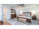 Bright main bedroom with modern decor, ceiling fan, and wooden floors at 8665 Sw 94Th Ln # C, Ocala, FL 34481