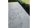 Paver patio and chain-link fence bordering well maintained garden area at 8665 Sw 94Th Ln # C, Ocala, FL 34481