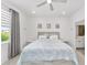 Neutral Primary bedroom featuring a queen size bed, lots of light, and adjacent bathroom at 8769 Sw 79Th Pl, Ocala, FL 34481