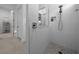 Modern bathroom featuring a stylish shower with a textured tile wall and mosaic floor at 8825 Sw 57Th Place Rd, Ocala, FL 34481