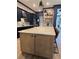 A modern kitchen boasts a large island with light countertops, offering an inviting and functional space at 8825 Sw 57Th Place Rd, Ocala, FL 34481